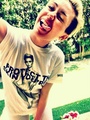 Miley in her own "Protect The Skin "U're In t-shirt - miley-cyrus photo
