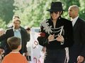 Signing An Autograph For A Young Fan - michael-jackson photo