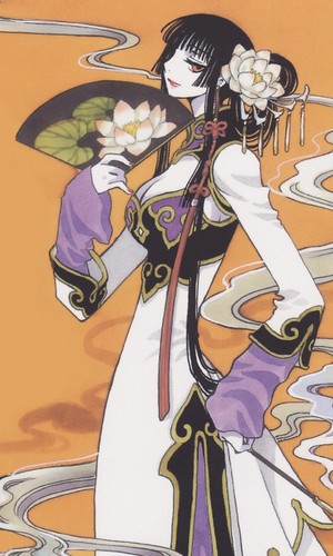  Yuko holding a peminat and wearing a Chinese-style dress