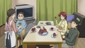 Kosuda and his family eating chocolate cake - anime photo