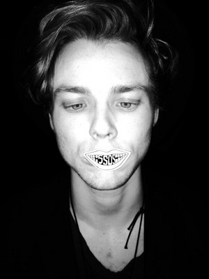 Ashton with a sticker on his mouth!