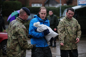 Royal Princes Help Build Flood Defenses