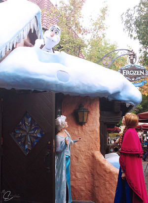  Elsa and Anna checking up on Olaf
