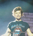 Harry reacting to a woman in the audience saying he was in trouble with her. (x) - harry-styles photo