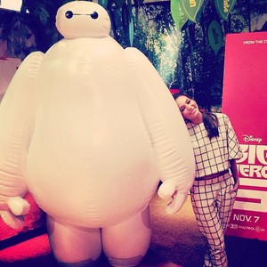  Genesis Rodriguez posses with Baymax