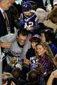 SuperBowl 49 MVP Tom Brady,with wife Gisele and his 2 sons John(on his shoulders) and Benjamin - nfl photo