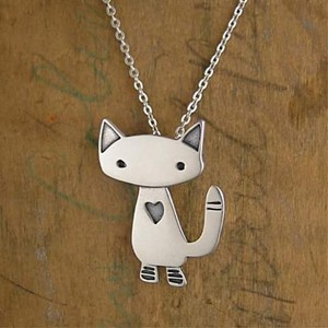  A sterling silver alley cat charm dangling.