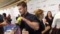 Emily giving Stephen jelly beans at PaleyFest 2015. - stephen-amell-and-emily-bett-rickards photo