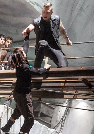  Jai Courtney as Eric with Zoe Kravitz in Divergent