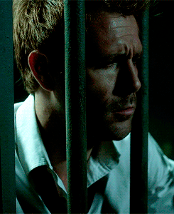 John behind bars