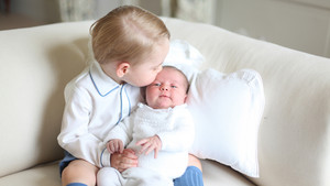 prince George kissing princess Charlotte 