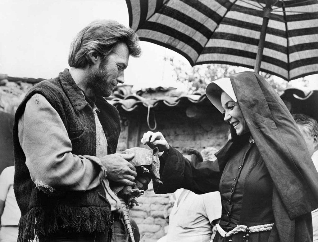 http://images6.fanpop.com/image/photos/40400000/Clint-Eastwood-and-Shirley-MacLaine-on-the-set-of-Two-Mules-for-Sister-Sara-clint-eastwood-40433569-1024-781.jpg