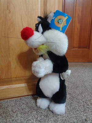 Ace Sylvester cat eats Tweety plush toy