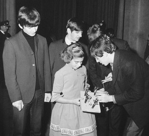 Beatles with their fans