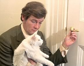  Sir Roger Moore With Cat