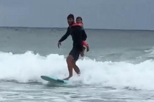  Chris going surfing with daughter India