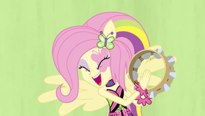 Fluttershy playing tambourine in the band EG2