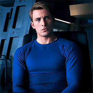 Steve Rogers in tight blue long sleeve shirt
