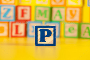 Photograph Of Colorful Wooden Block Letter P