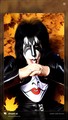 KISS bassist Gene Simmons laying on leaves 2nd photo - kiss photo