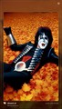 KISS bassist Gene Simmons laying on leaves - kiss photo
