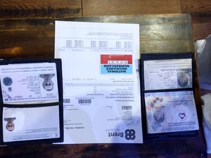  My passport with my National Insurance card, my husband's passport and a letter to us