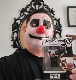  Angus Oblong holding a Angus Oblong Funko Pop