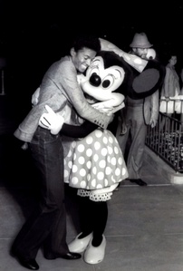  Who is this man in the photograph with Minnie
