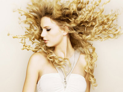 Mostly of the songs in Fearless is about who?