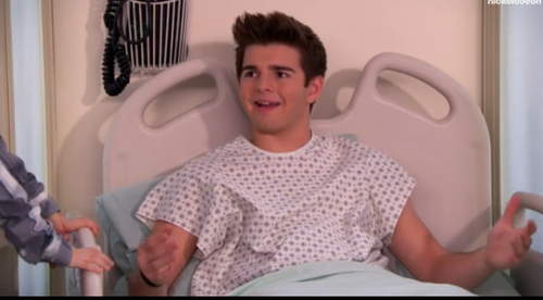 Why is Max in the hospital bed?