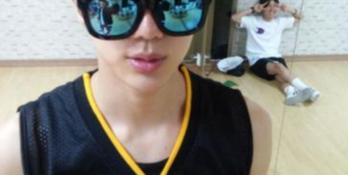 In the full size of this photo, how many pairs of sunglasses is Jin wearing?