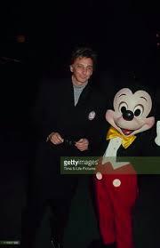 Who is this man in the photograph with Mickey Mouse