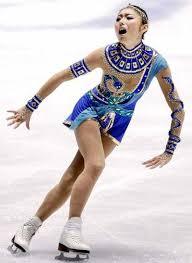 How many gold medals did Miki Ando win while she was a figure skater?