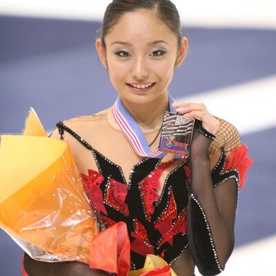 Where did Miki Ando win her first gold medal?