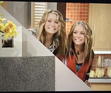 Which Olsen Twin is on the left side in this so Little Time photo of the Job?