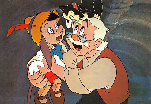  When was the first time that Pinocchio was reunited with Geppetto, Figaro and Cleo after he left to go to school?