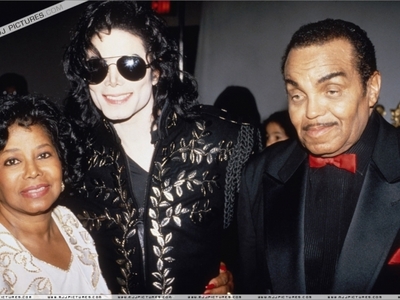  What event was this photograph of Michael and his parents taken
