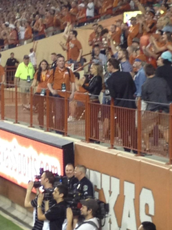 Filming a scene with Michael Fassbender during a game at Darrell K Royal-Texas Memorial Stadium, Aus