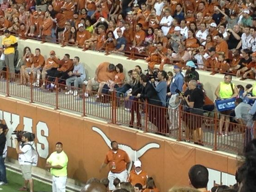 Filming a scene with Michael Fassbender during a game at Darrell K Royal-Texas Memorial Stadium, Aus