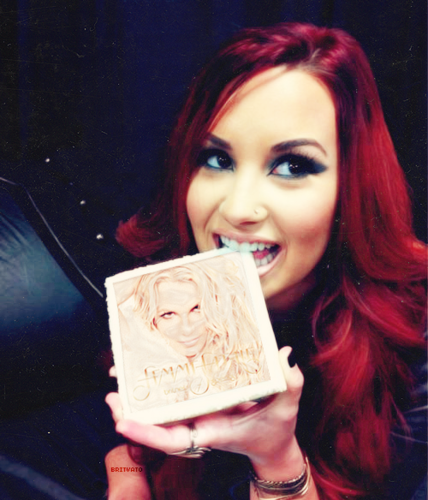  Demi Lovato holding Britney Spears CD