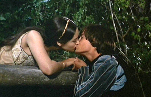 Romeo & Juliet about to kiss on Balcony.