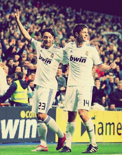  Xabi Alonso and Mesut Ozil