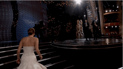  Jennifer trips up the stairs before accepting the Oscar