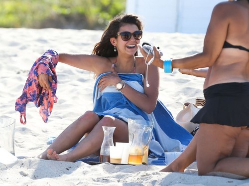 Julianne Hough and Nina Dobrev hanging out with friends on the beach in Miami