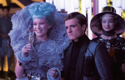 New Official Catching Fire still featuring Effie and Peeta