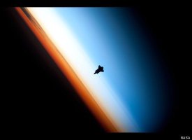  The Silhouette of the Space Shuttle Endeavour~