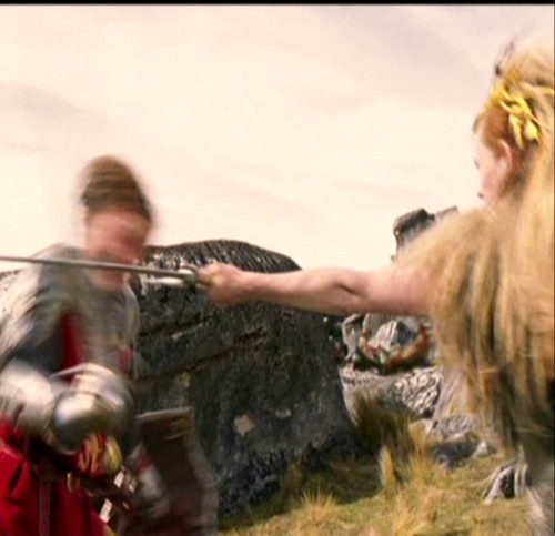  Jadis swings her sword at Peter's head.