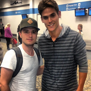  Josh with a پرستار in an airport