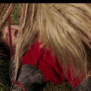  Jadis pins Peter to the ground with her sword.