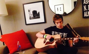  Luke playing guitar, gitaa